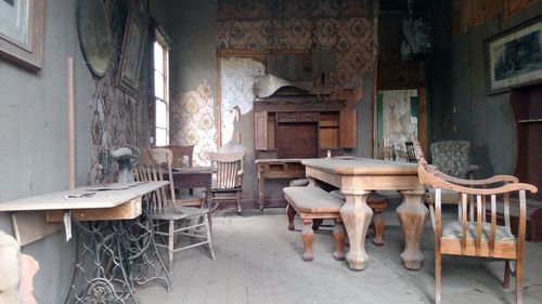 Chairs and table in abandoned room