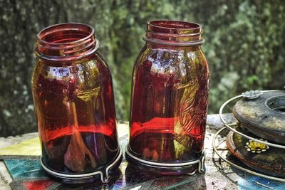 Close-up of red glass bottle