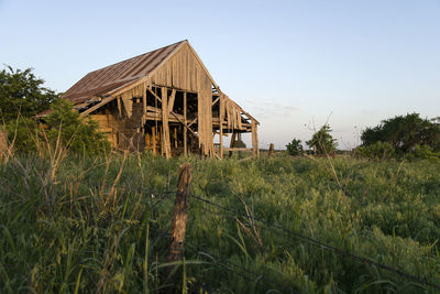 Abandoned building against clear sky
