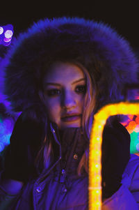 Portrait of young woman in winter at night