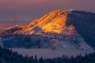 Scenic view of mountains against sky during sunset