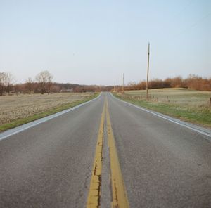 Empty road along landscape