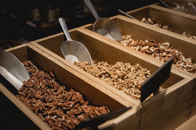 Close-up of dried food in wooden containers at market