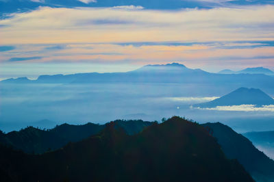 Scenic view of mountains against sky during sunset