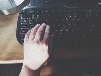 Close-up of human hand using mobile phone