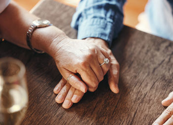 Midsection of man holding hands