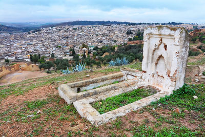 Cemetery at fes el bali against cityscape