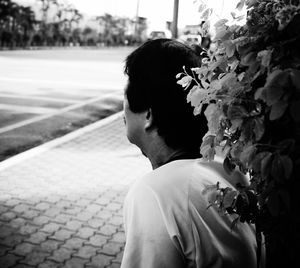 Rear view of man on flower