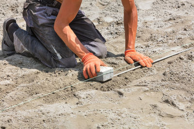 Low section of man working at construction site