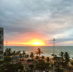 Scenic view of beach against sky during sunset