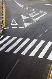 High angle view of arrow sign on road