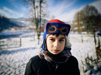 Portrait of boy wearing warm clothing during winter