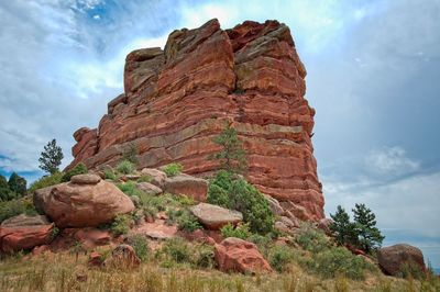 Low angle view of rock formation against sky