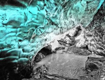 Close-up of water flowing through rocks