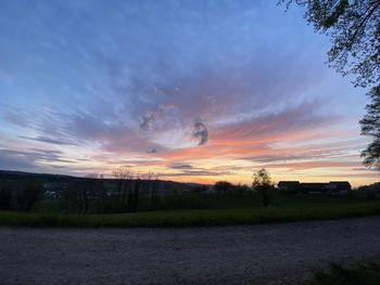 Scenic view of field against sky during sunset