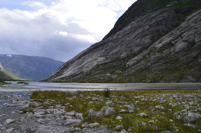 Scenic view of mountains and lake against sky