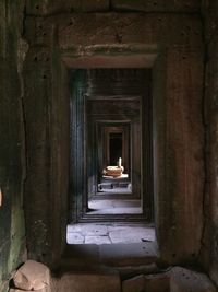 Man walking in corridor of historic building