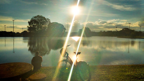 Scenic view of lake against sky during sunset