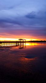 Scenic view of sea against orange sky