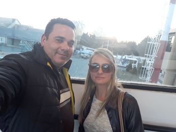 Portrait of smiling young woman in car