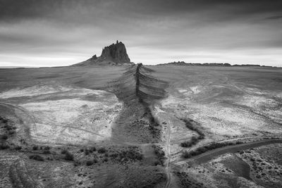 Scenic view of shiprock, nm against sky