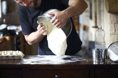 Midsection of man preparing food