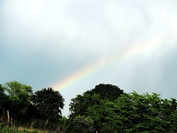Low angle view of rainbow against sky