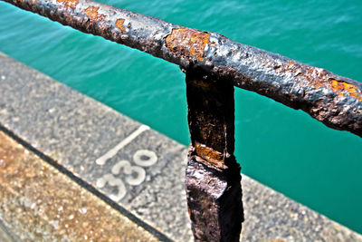 High angle view of rusty metal by sea