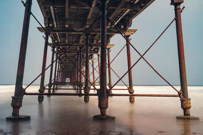 Low angle view of pier against sky