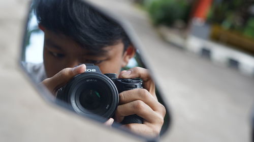 Portrait of man photographing