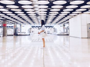 Full length of woman standing on floor