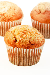 Close-up of cupcakes against white background