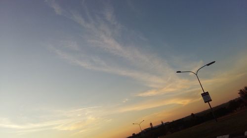 Low angle view of street light against sky