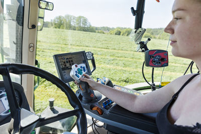 Woman driving tractor