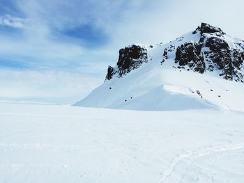 Snow covered mountain against sky