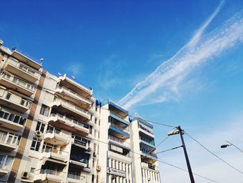 Low angle view of buildings against blue sky