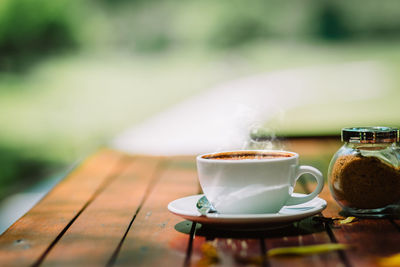 Close-up of coffee cup on table