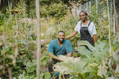 Portrait of male and female volunteers in urban farm