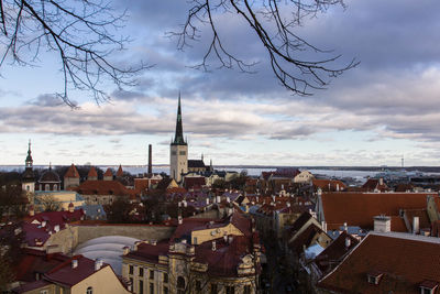 High angle shot of townscape against cloudy sky