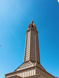 Low angle view of historical building against clear blue sky