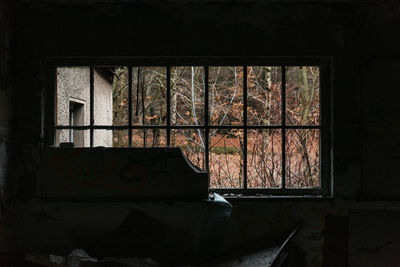 Abandoned building seen through window