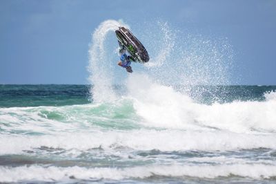 Low angle view of jet ski in action