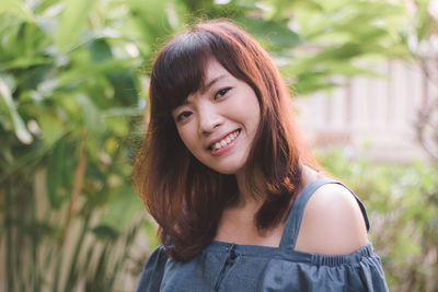 Portrait of smiling young woman