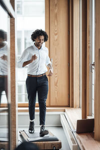 Full length of a young man looking up