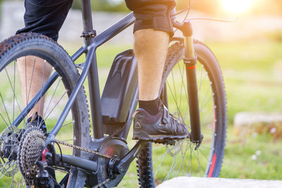 Low section of person riding bicycle