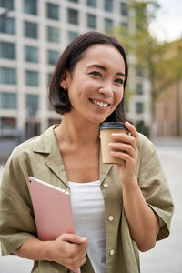 Young businesswoman using mobile phone