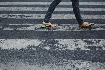 Low section of people standing on road