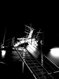 Low angle view of ferris wheel at night