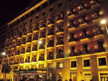 Low angle view of illuminated building at night