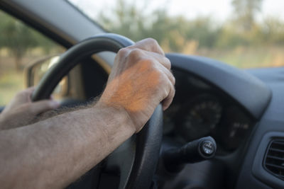 Close-up of man driving car